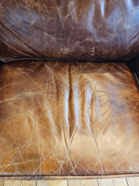 Fauteuil en cuir avec accoudoirs